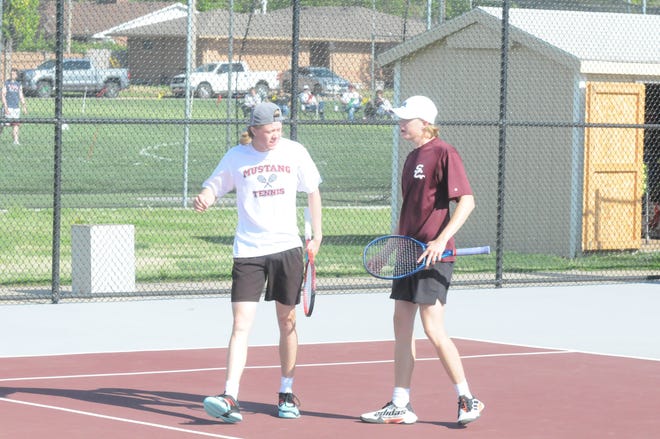 Salina Central's Collin and Connor Phelps encourage each other after a point during their regional championship match Friday, May 6, 2022, at Salina Central Tennis Courts.