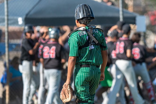 Victor Valley catcher Dominic Dominguez watches as Valley View players celebrate after taking the lead Friday, May 6, 2022.