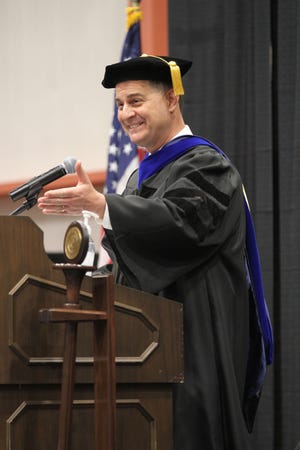 Dr. Cory Stine, exectutive director, Terra College Foundation, speaks to the graduates during Terra State Community College's 53rd commencement ceremony on Friday.