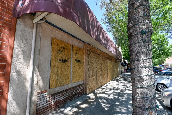 Three businesses on Main Street are boarded up Friday, May 6, 2022 after Sunday's fire near the Fox Theatre.