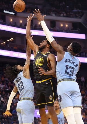 Memphis Grizzlies guard Ja Morant (12) and forward Jaren Jackson Jr. (13) defend a shot by Golden State Warriors guard Andrew Wiggins during game three of the second round for the 2022 NBA playoffs at Chase Center on Saturday, May 7, 2022. 
