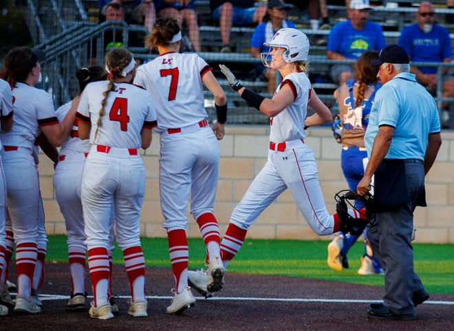 Lake Travis Cavaliers' Payton Trickett crosses home plate after her game-winning home run in extra innings of the third game in the Class 6A Region IV area-round playoff series Saturday at Westlake High School. The Cavs rallied for a 6-5 win in the third game to win the series and reach the third round of the playoffs.