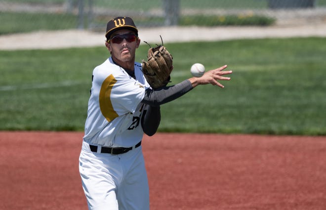 The College of Wooster's Dean Brown makes a throw.