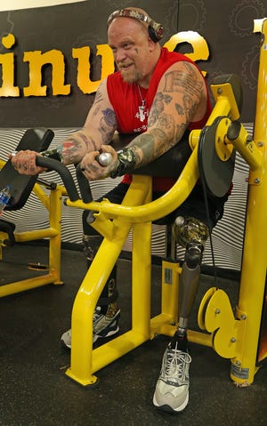 Brian Conwell works out at the Planet Fitness on Park Street in Belmont Monday morning, May 9, 2022.