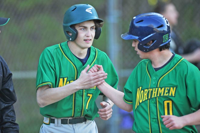 North Smithfield's Cole Skinner, left, and Tyler Albino celebrate after the two scored on a triple by Danny White in the seventh inning of Monday's 5-1 win over Classical.