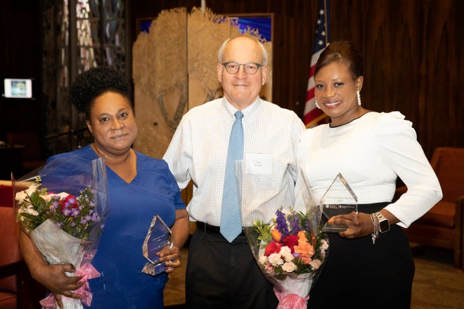 Brockton resident Dadie Petit-Frere, C.N.A., right, and Randolph resident Carline Cenat, R.N., were honored as Personal Care Associate of the Year and Registered Nurse of the Year, respectively. Lou Woolf, president and CEO of nonprofit Hebrew SeniorLife, congratulates the two winners.