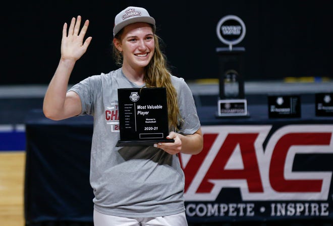 California Baptist's Caitlyn Harper poses with her Most Valuable Player award after defeating Grand Canyon 78-60 in an NCAA college basketball game for the championship of the Western Athletic Conference women's tournament Saturday, March 13, 2021, in Las Vegas. (AP Photo/Chase Stevens)