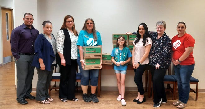 Pictured from left are Charles Turner, executive assistant to superintendent; Tina Marrufo, employee benefits; Jessica Etcheverry, public information director; Annette Toney, Customer Engagement Specialist for Girl Scouts of the Desert Southwest; Isabella Lozano, Girl Scout Troop #56246, Susy Au, payroll; Denise Ruttle, chief human resources officer; Jennifer Lozano troop #56246 leader, and mom.