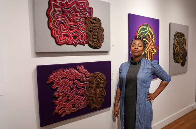 Stormie True stands next to her textile artwork during Black Matter, a traveling exhibition featuring Oregon-based Black artists, at Bush Barn Art Center on Friday, May 6, 2022, in Salem, Ore.