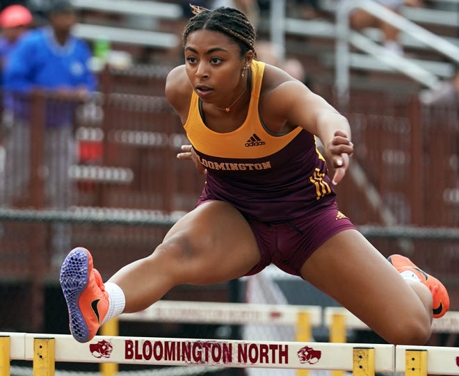 Bloomington North’s Kyla Kante runs to a win in the girls' 100 meter hurdles during the Conference Indiana track meet at North on April 29, 2022.