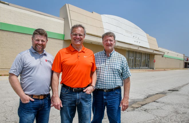 Mayor Jeff Kaufman, trustee Steve Leitch, right, and Director of Public Works Craig Lowdermilk stand in front of the long-vacant Kmart building at 1075 Jackson Street in the Morton Village Shopping Center. U-Haul is working with village officials and Dan Maloof of Maloof Commercial Real Estate to buy and convert the building into a massive new climate-controlled storage facility.