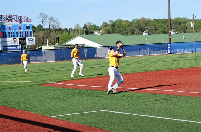 Lancaster third basemen Alex Miller prepares to catch a popup while shortstop Tony Falvo looks on during the Golden Gales' 6-0 win over Pickerington Central on Monday. Lancaster cliched a share of the Ohio Capital Conference-Buckeye Division championship with the win.