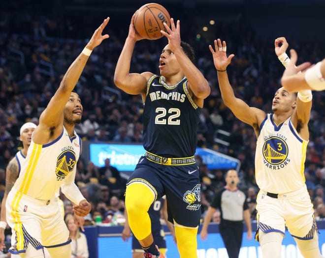 Memphis guard Desmond Bane shoots over Golden State's Otto Porter Jr. (32) and Jordan Poole (3) during Game 4 of their NBA playoff series at Chase Center on Monday, May 9, 2022.