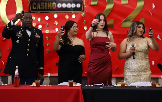 Lt. Col. Todd Moultrie, Cadet Battalion Commander Mayra Calderon, Cadet Executive Officer Georgia Turnbow and Cadet Command Sergeant Major Corina Chavira perform a toast to the Deming High School Wildcat Battalion.