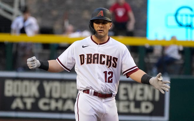 Daulton Varsho of the Arizona Diamondbacks celebrates after scoring a double against the Miami Marlins during the first half of a baseball game on Monday, May 9, 2022 in Phoenix.