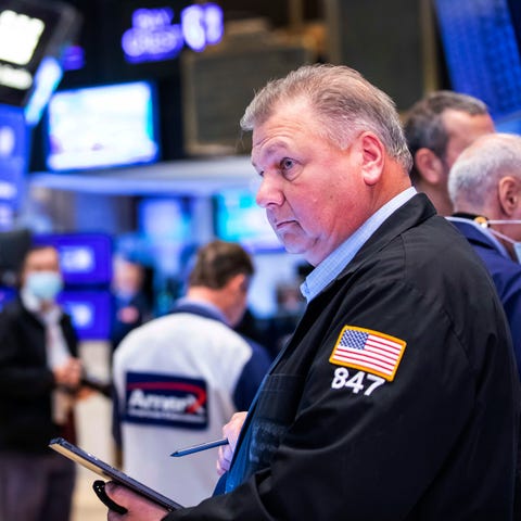 Traders work the floor at the New York Stock Excha