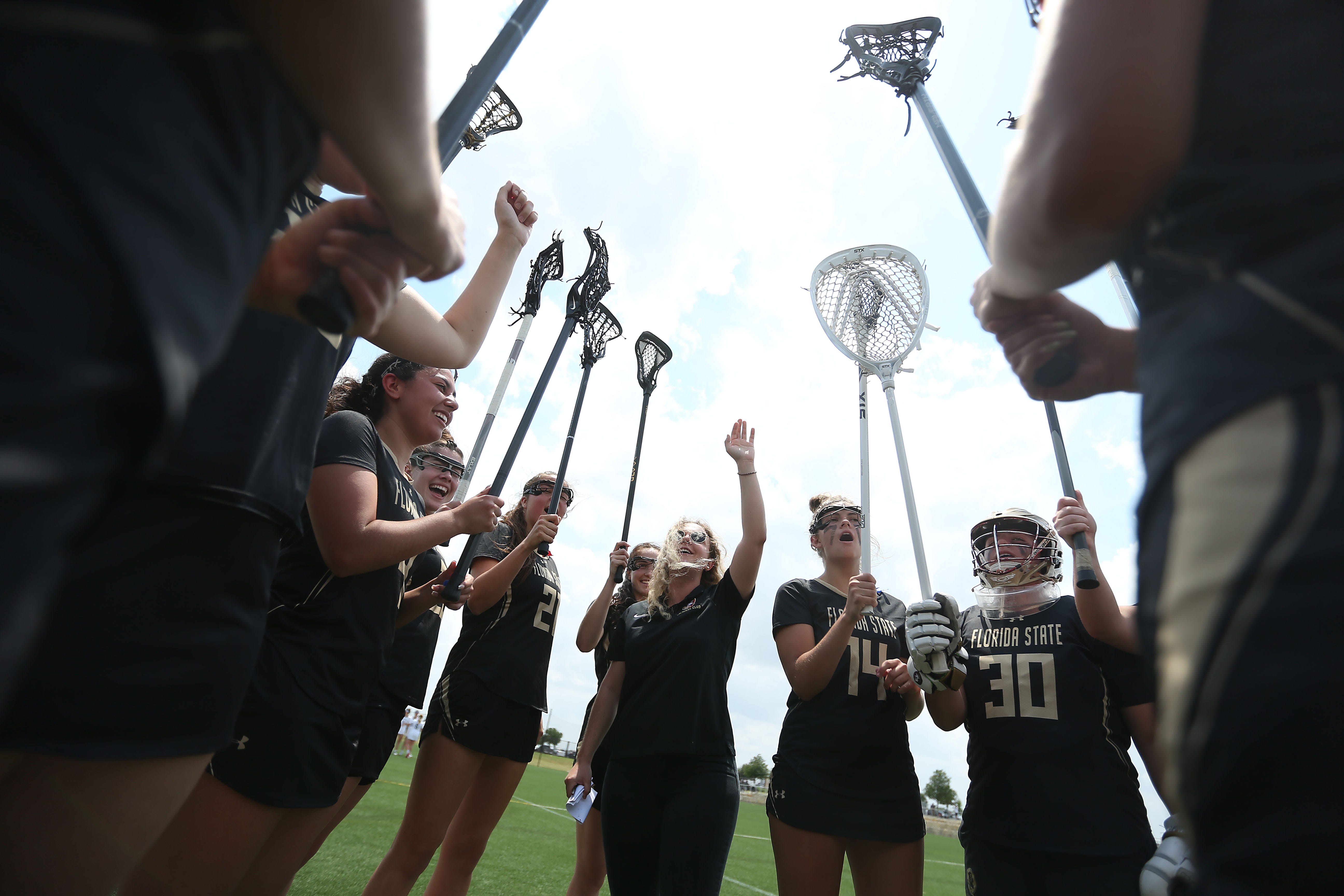 Olivia Friedley, Florida State club lacrosse coach, cheers with the team before their game against BYU in the Women's Collegiate Lacrosse Associates National Championships Wednesday, May 4, 2022, in Round Rock, Texas.