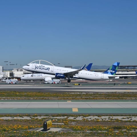 A JetBlue Airways Airbus A321 takes off from Los A