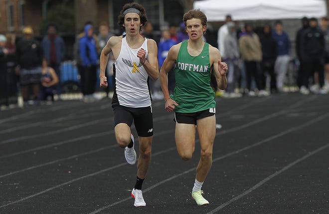 Upper Arlington's Evan Hughes sprints against Dublin Coffman's Noah Clemens in the 1,600 during the UA Invitational on April 2. Hughes, a senior, plans to chase Division I state berths in the 800 and 1,600. His father, Darrell, won the 800 and 1,600 state titles for Westland in 1990 and 1991.