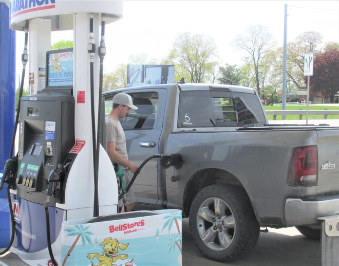 Brian Schlabach fills his truck's gas tank at the BellStores Marathon station in Walnut Creek, where the price per gallon was $4.29.
