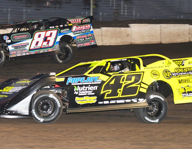 Fairbury's McKay Wenger (42) races with Scott James. Both drivers will be racing their late models in the FLO Racing Illinois Speedweek. Wenger will be looking to defend his home turf at the Farmer City Raceway and Fairbury Speedway.