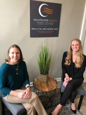 Rebecca Pare, APRN, lead practitioner at Nightwater Heatlh Women's Wellness and Primary Care at Exeter, and Jennifer Moran, practice manager, in the waiting room of the new Exeter medical practice.