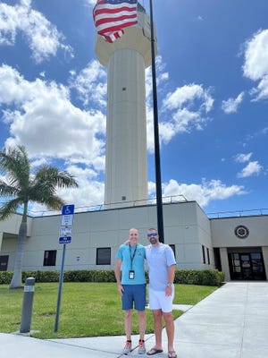 Controller Robert Morgan (left) and passenger Darren Harrison outside of the Palm Beach air traffic control facility. Morgan helped Harrison, who had no flying experience, land a single-engine Cessna safely after an unusual in-flight emergency on May 10, 2022.