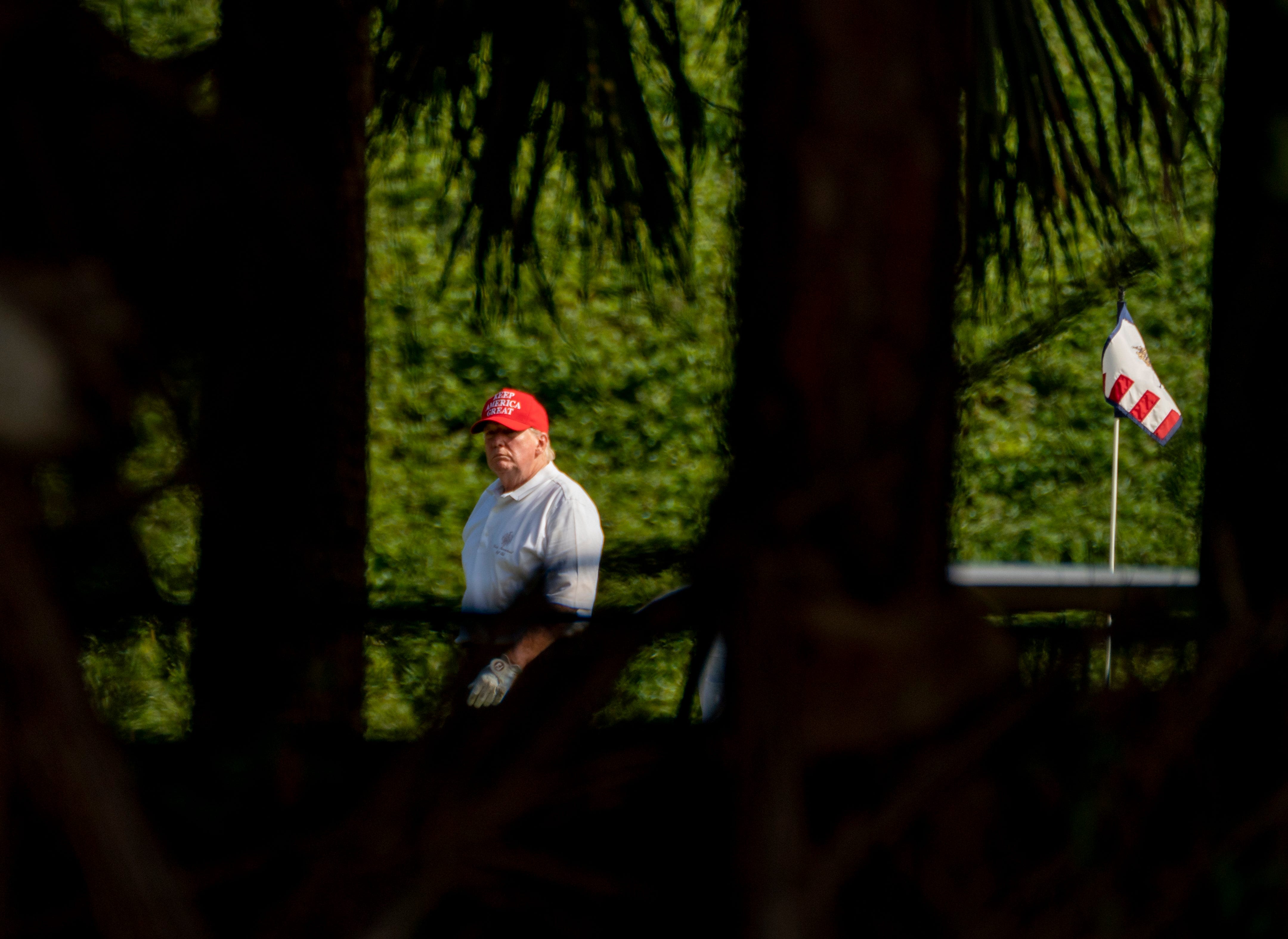 President Donald Trump plays golf at his Trump International Golf Club in West Palm Beach, Florida on December 28, 2020. (GREG LOVETT/PALM BEACH POST)

