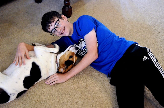 When he's not practicing his spelling words, Andrew Yeager of Doylestown spends time playing with his family's dog, Belle. Yeager will compete in late May in the Scripps National Spelling Bee outside Washington, D.C.