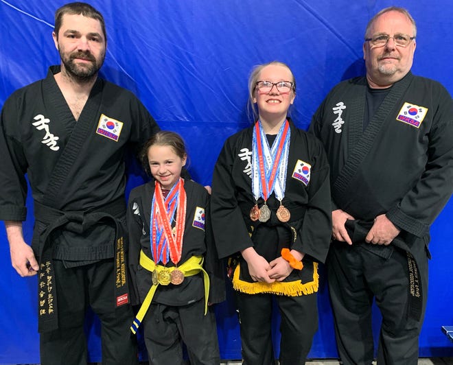 Ben Forejt II, Kylyn Forejt, Madison Lee and Ben Foreft, are pictured from left to right. The grandfather, father, daughter and granddaughter from Sault Ste. Marie took part in a Midwest Regional martial arts tournament in St. Louis recently.
Madison Lee, who competed as a Black Belt, won 2nd place in sparring, 3rd place in Staff competition, and 3rd place in Sword competition.
Kylyn Forejt, who competed as a Yellow belt, won 1st place in Sparring, 3rd place in Techniques competition, and 4th place in Forms competition.
Grandfather Ben Forejt and father Ben Forejt II are both 5th degree masters in the style of Kuk Sool Won and they spent their time judging other competitors.