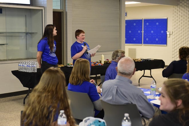 Elyssa Roberts and Connor Bloomfield of the Wynford Interact Club address members of Bucyrus Rotary on Tuesday during a joint meeting of the two organizations.