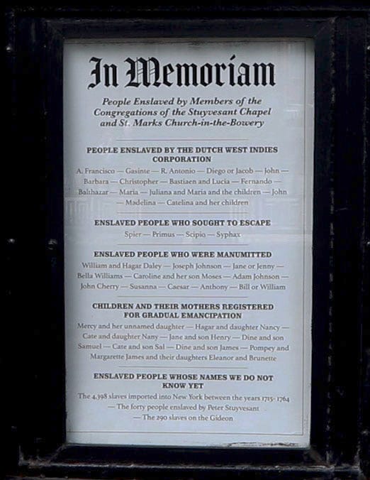A sign at the entrance to St. Mark's Church-in-the-Bowery in Manhattan's East Village, photographed May 10, 2022, memorializes members of the church that had been enslaved. The Episcopal Diocese of New York has formed the committee to decide what reparations for slavery could look like.