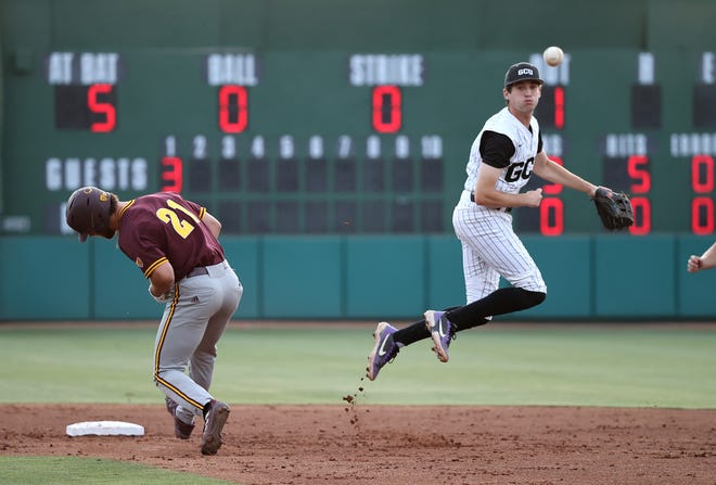 Grand Canyon shortstop Jacob Wilson turns a double play in 6-4 loss to Arizona State.