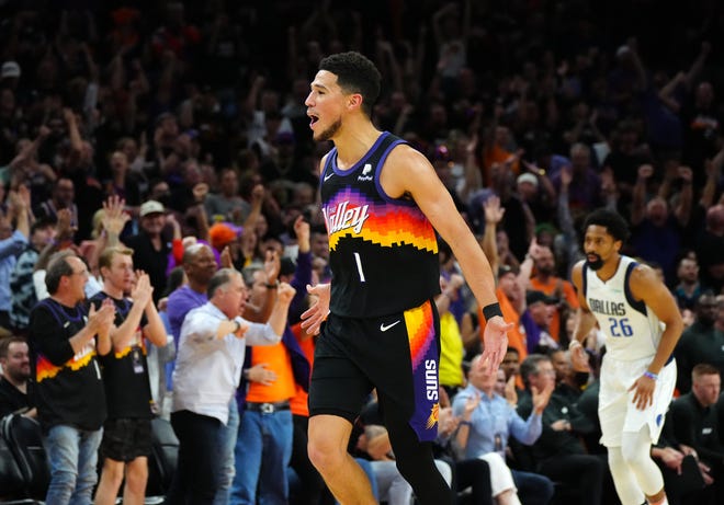 May 10, 2022; Phoenix, Arizona; USA; Suns Devin Booker (1) celebrates against the Mavericks during game 5 of the second round of the Western Conference Playoffs.