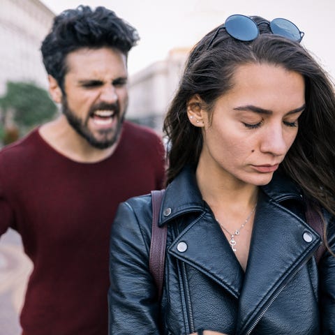 Bearded man shouting at his girlfriend