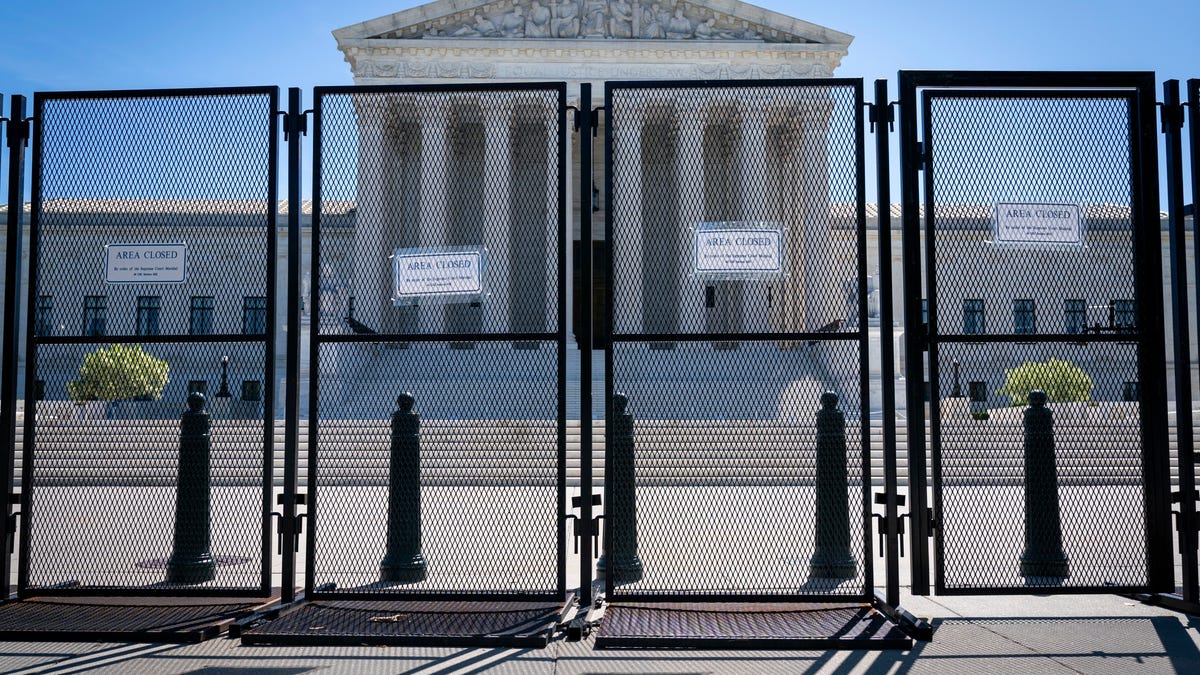 Anti-scaling fencing blocks off the stairs to the Supreme Court, Tuesday, May 10, 2022, in Washington.
