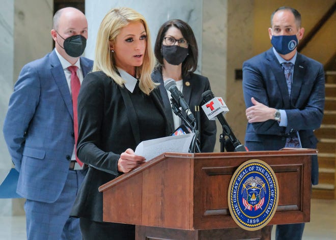 Paris Hilton, who has spoken out about the abuses she said she experienced at Provo Canyon School, center, was an advocate for the new law along with Utah Gov. Spencer Cox Cox and Lt. Gov. Deidre Henderson.