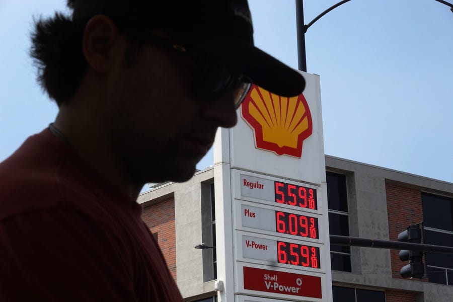 A customer purchases gas at a gas station on May 10, 2022 in Chicago, Illinois. Nationwide, the average price for a gallon of regular gasoline reached a record high today of $4.37 a gallon.