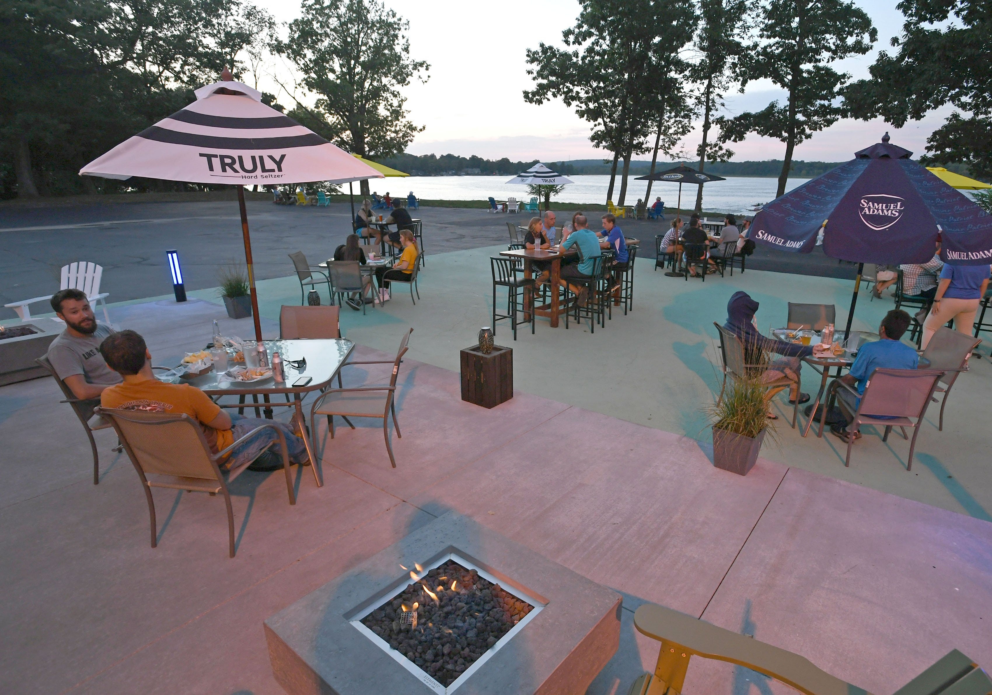 It's all about the sunsets over Edinboro Lake at the Lakeside Beach Bar at Lakeside Commons in Edinboro. Shown here on Aug. 13, 2020, there are plenty of socially-distanced tables outside for patrons to enjoy the views and also slow the spread of COVID-19.