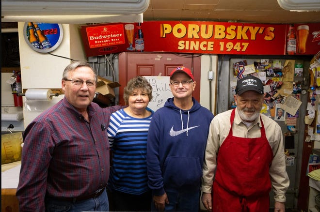 Bill Pierson, from left, his wife, Cecelia Pierson and her siblings Matthew Porubsky and Charlie Porubsky were all involved with Porubsky's, an iconic North Topeka deli known for its chili and hot pickles. The eatery closed April 30.
