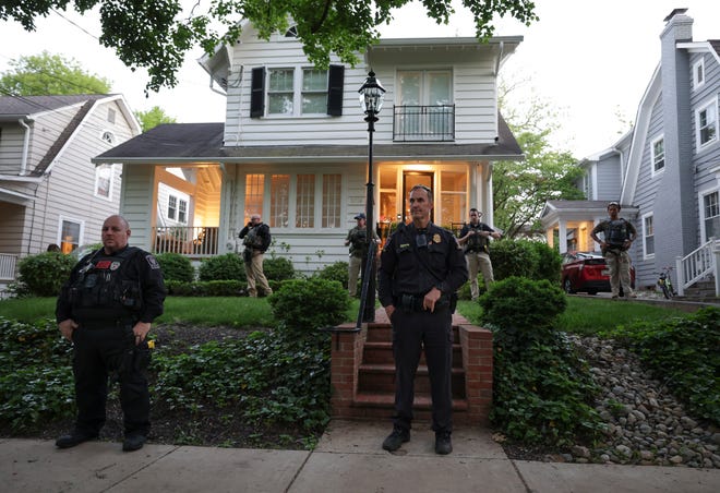 Police stand outside the home of U.S. Associate Justice Brett Kavanaugh as abortion-rights advocates protest on May 11, 2022 in Chevy Chase, Maryland.