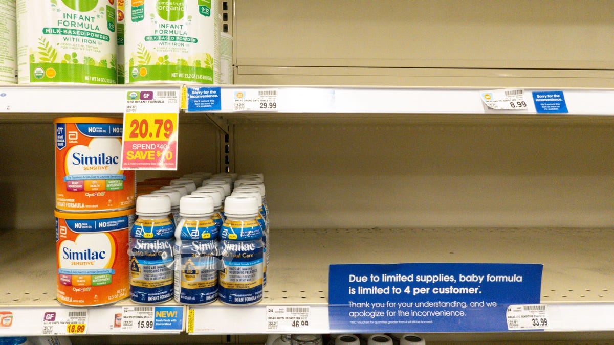 A small amount of baby formula is displayed on the shelves of a grocery store with a sign limiting purchases in Indianapolis on May 10, 2022.