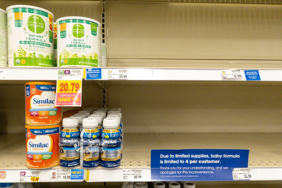 Baby formula is displayed on the shelves of a grocery store with a sign limiting purchases in Indianapolis on May 10, 2022. Parents across the U.S. are scrambling to find baby formula because supply disruptions and a massive safety recall have swept many leading brands off store shelves.