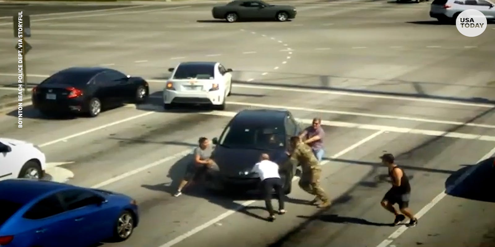 Video shows people saving woman having medical episode while driving