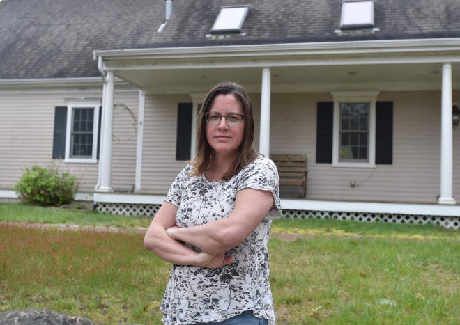Yarmouthport homeowner Jami Carter outside her property where she planned to install solar panels through a town of Yarmouth program called Solarize Yarmouth. Solar Wolf Inc., the company contracted for the work, has allegedly defrauded a number of clients in the town. Steve Heaslip/Cape Cod Times