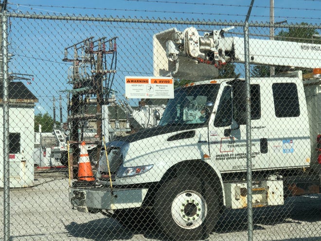 A few American Electric Power vehicles were parked at the power station along Beall Avenue in downtown Wooster to repair a piece of equipment that failed on Thursday.