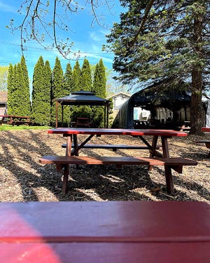 Lucky Louie's, 8238 Perry Highway, invites guests into a shady plot with picnic tables and a party shelter tent.