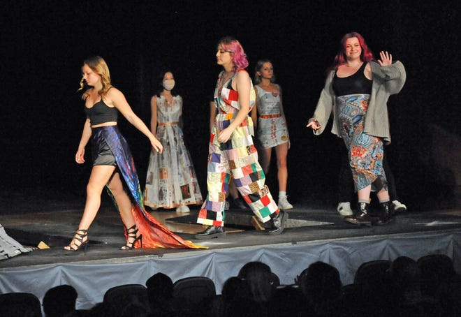A group of Quincy High School student models walk the runway during the Quincy High School Fashion Show, Thursday, May 12, 2022.