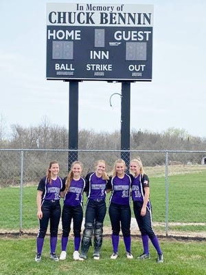 Pickford dedicated a new scoreboard at its softball field Thursday. The scoreboard is in memory of Chuck Bennin. Pictured from left to right are Pickford Panthers' who are all related to Chuck Bennin, including Chloe Cottle, Lizzie Storey, Lucy Bennin, Ahna Prucha and Madison Thurmes.