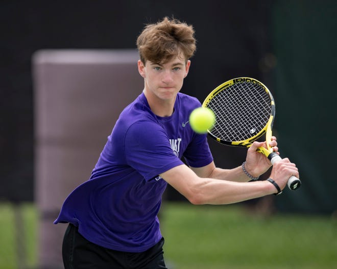 Topeka West's Ian Cusick returns the ball on day one of the state tournament on Friday May.  13, 2022, at Kossover Tennis Court in Topeka, Kan.